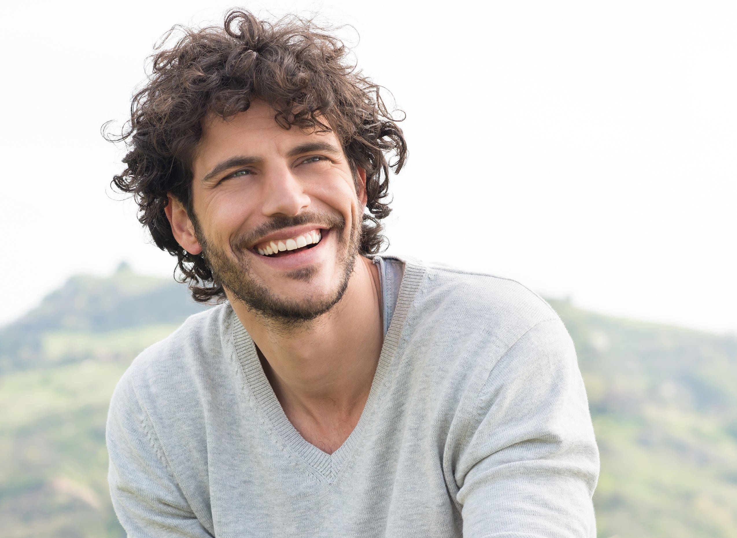 Portrait Of Young Handsome Man Smiling Outdoor